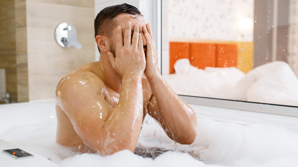 Man rinsing out beard wash