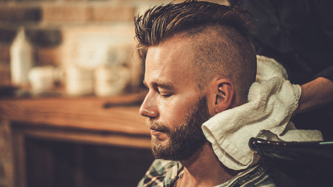 Man in barber chair after using beard conditioner