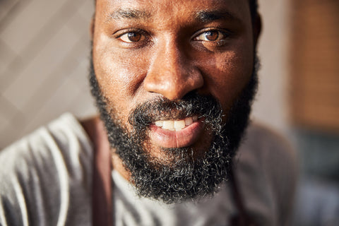 Close up photo of a man with a beard