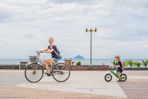 mom riding bike with kid