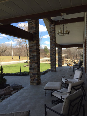 New sidewalk and patio with hanging chandelier lighting