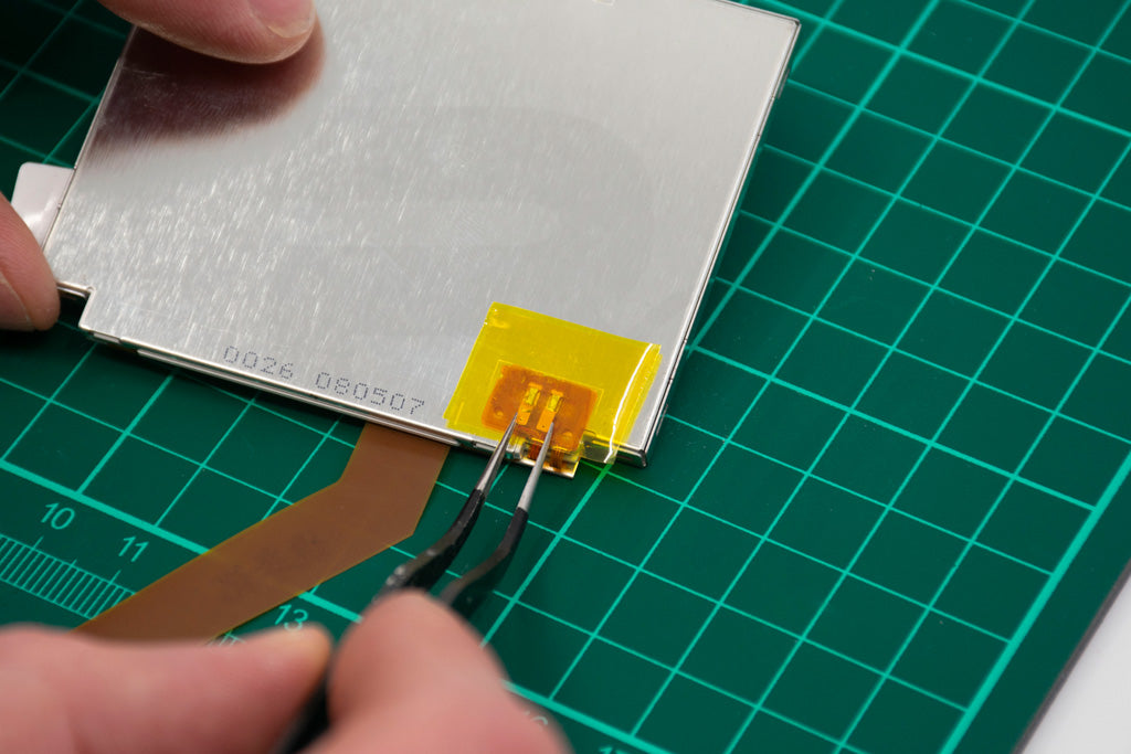 Add another piece of Kapton tape to hold everything in place