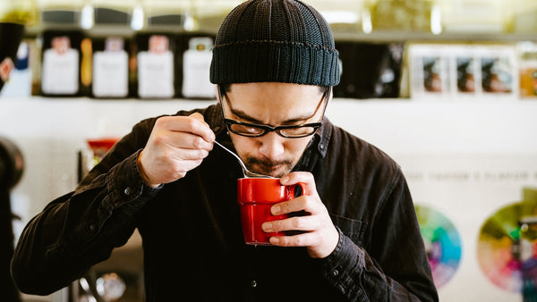 barista smelling coffee 