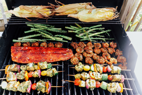 Grill filled with cod skewers, shrimp, sockeye fillet, corn and asparagus. 