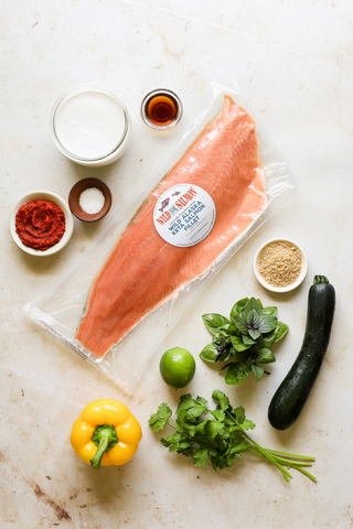 All ingredients to the Thai coconut salmon skewers laying out on a countertop