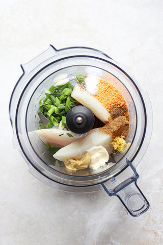 halibut and ingredients in food processor