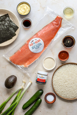 Keta Salmon fillet surrounded by the ingredients for the spicy salmon sushi bake recipe