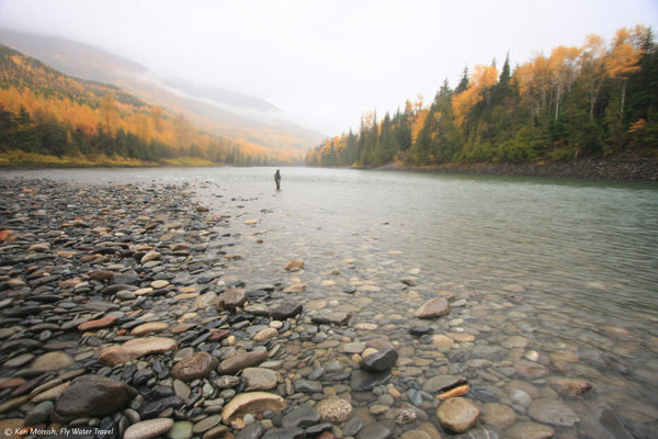 Fisherman fishing in a river. Image from the Wild Salmon Center. 