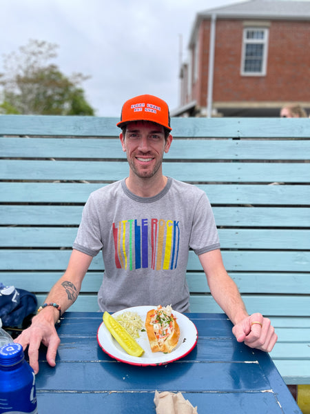 ben with lobster roll in shoot loads not guns hat