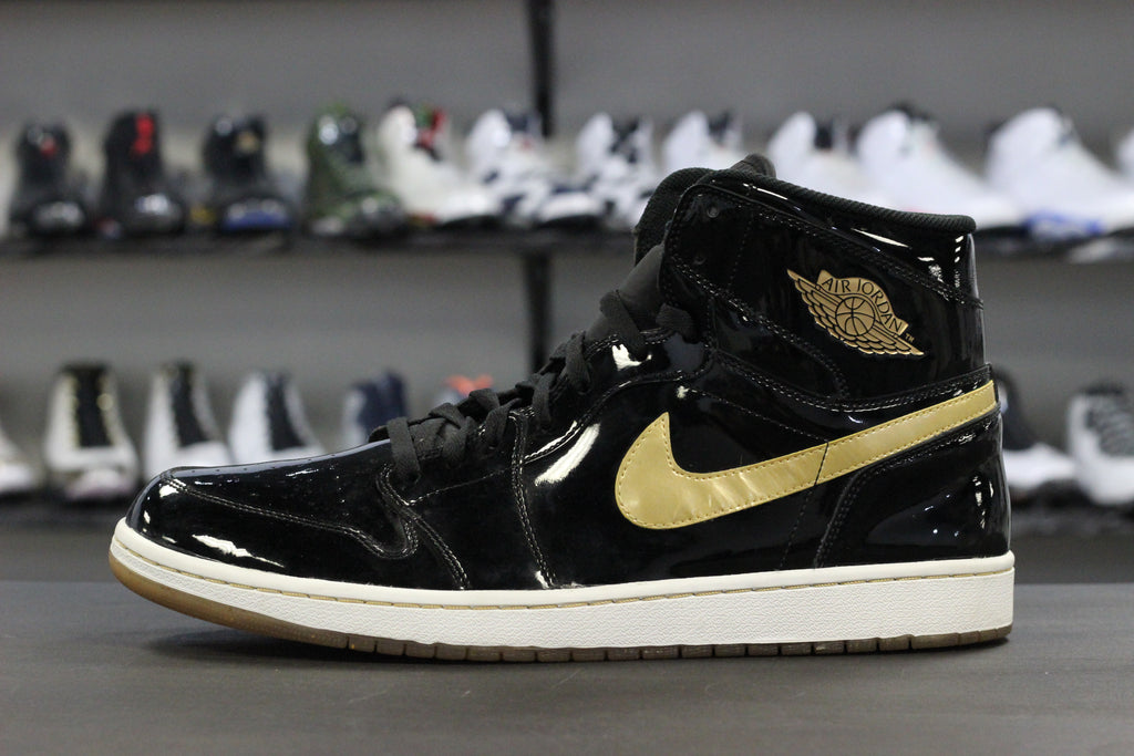 black and gold jordan 1