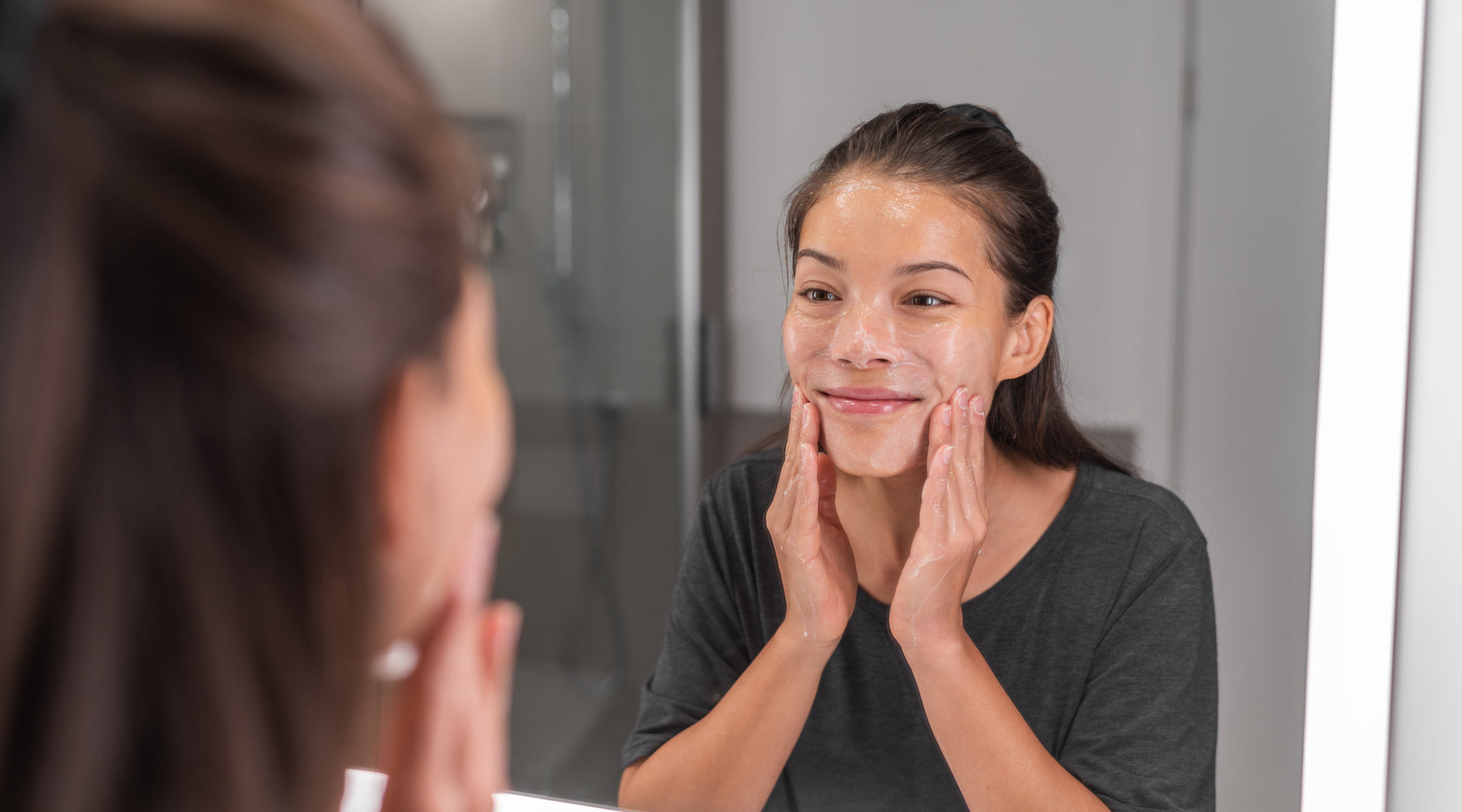 woman washing her face