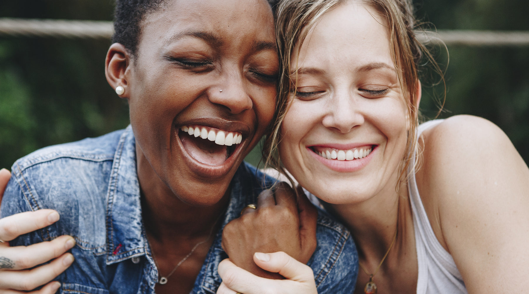 Two women laughing together