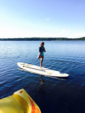 Lily doing YOGA on Paul Bunyan Paddle Board