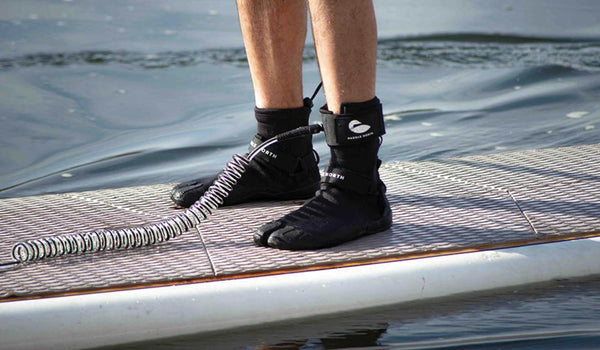 Ankle leash worn on paddle board