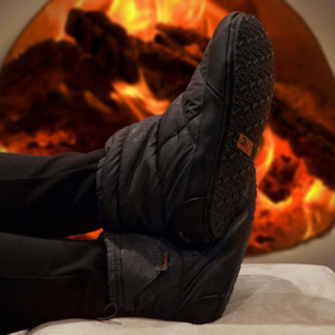 heated slippers in front of fireplace