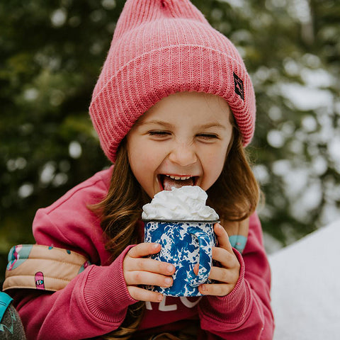 Little Girl Drinking Hot Chocolate and Wearing Ski Outfit with Super Soft One Size Beanie from Birdz