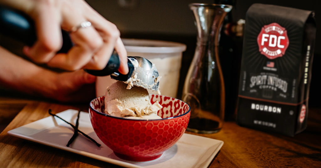 Scooping cold brew ice cream into a red bowl.