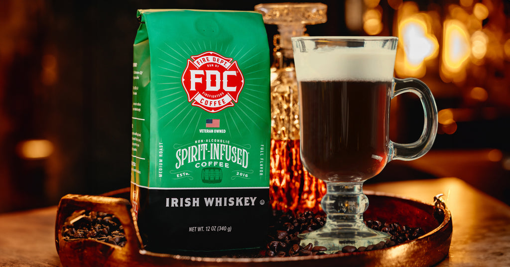 A bag of Irish Whiskey Infused Coffee on a tray next to an Irish coffee cocktail.