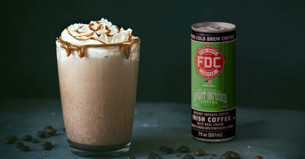 Frozen coffee in a glass cup with a Fire Dept. Coffee, Irish Coffee, Ready to Drink can.