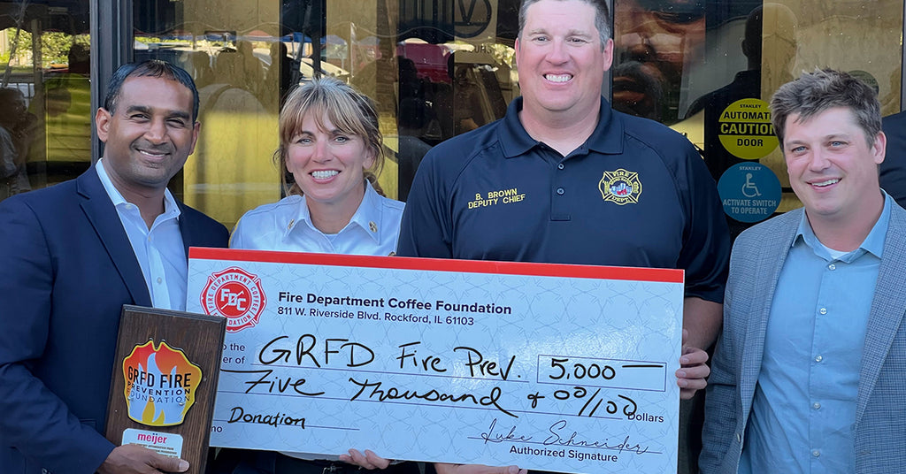 Donation check to GRFD Fire Prevention Foundation.