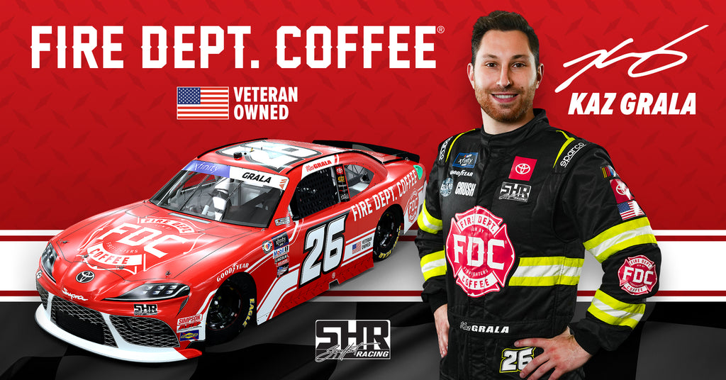 Kaz Grala of Sam Hunt Racing posing next to car with Fire Department Coffee design.