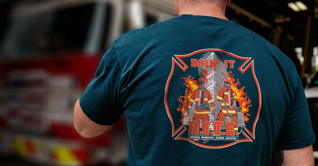 Firefighter displaying back of shirt that reads "Doin' it R.I.T.E.".