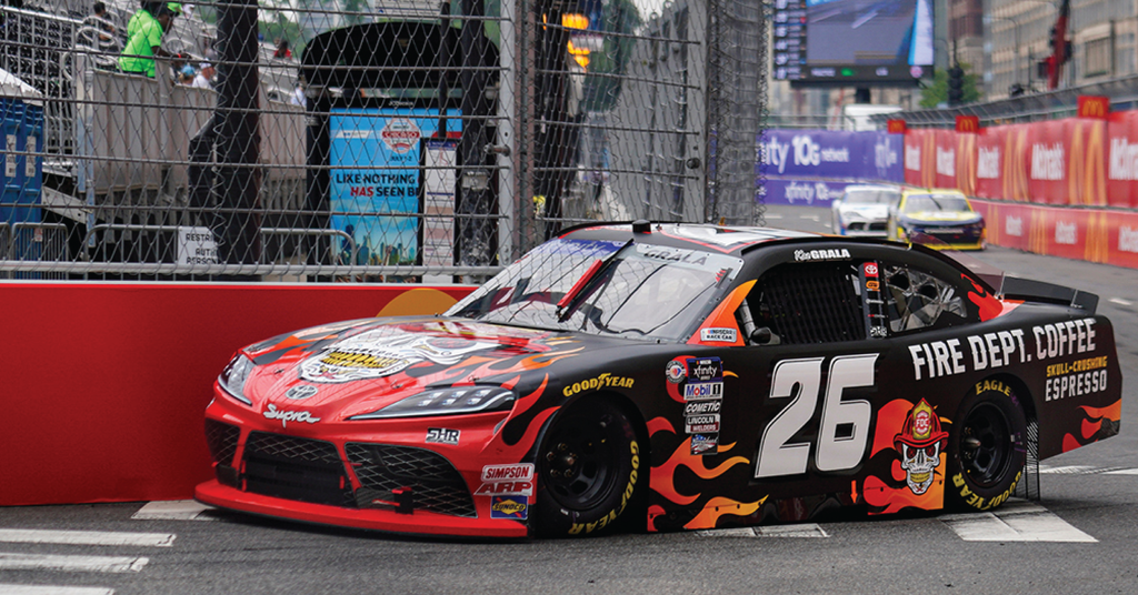 The number 26 car of NASCAR's Xfinity Series racing through the streets of Chicago.