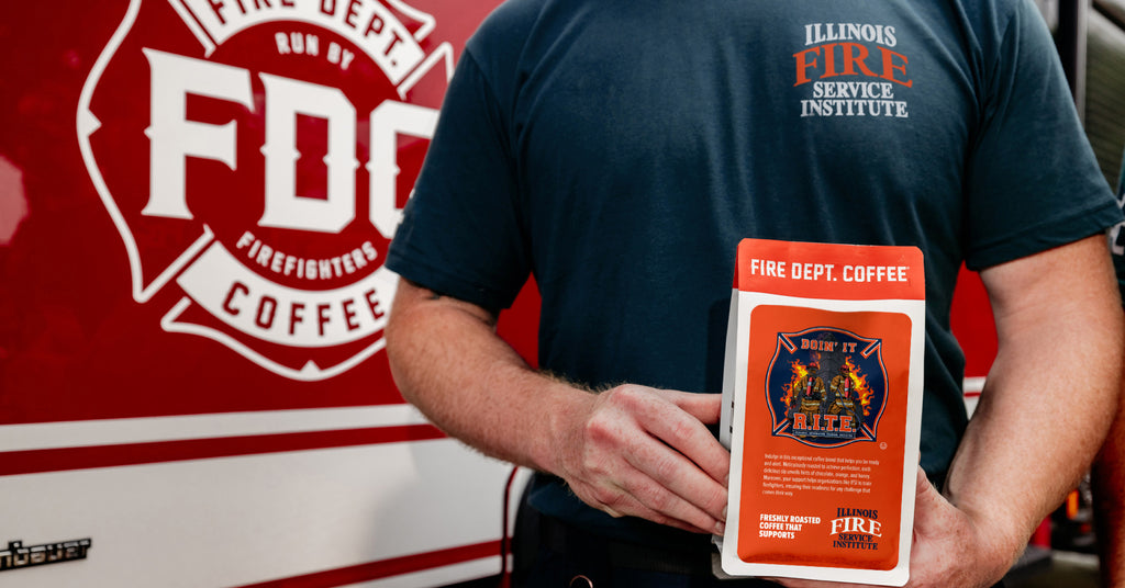 Firefighter holding a bag of coffee featuring IFSI.