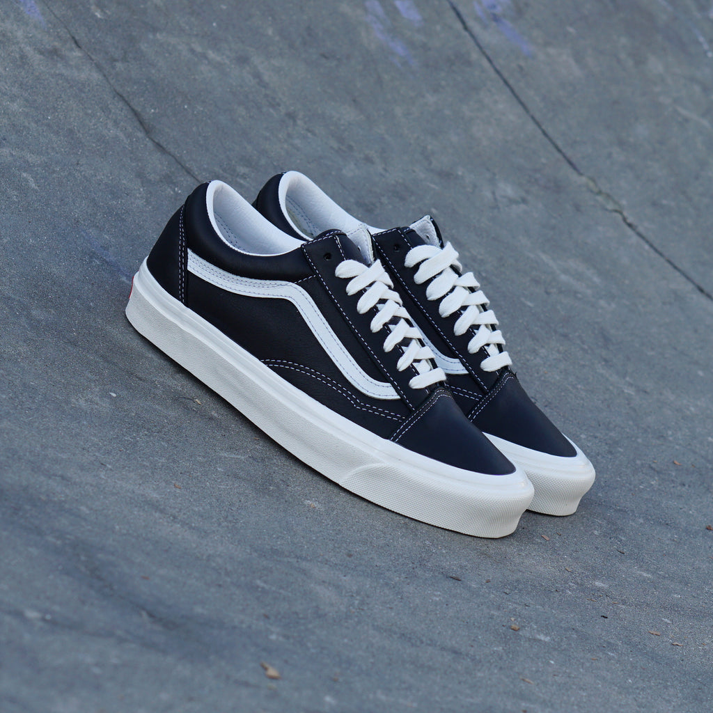 vans leather black and white