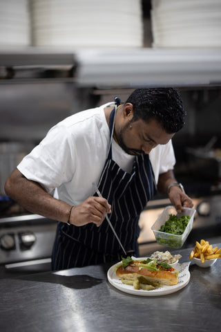 Chef Michael Bernerger Kevin preparing a dish for the Rosso Coffee Experience