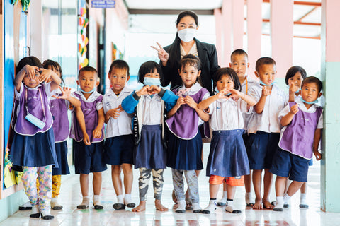 Thai children with their teacher