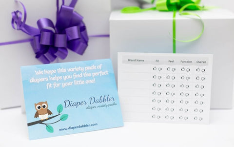 Diaper Brand Rating Card front and inside view with two gift boxes with ribbons in background