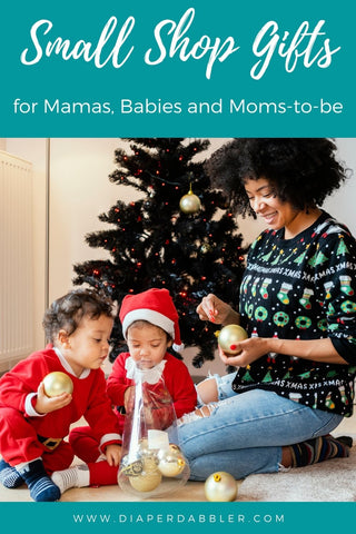 Photo of Mother and two babies in front of a Christmas tree with text "small shop gifts for mamas, babies and moms to be"