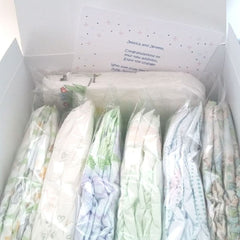 Diaper Sample Packs in a white gift box with gift card