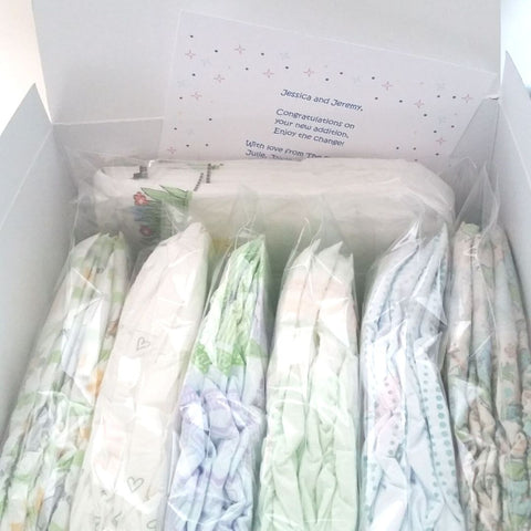 Diaper Sample Packs in various brands in a white gift box with gift card