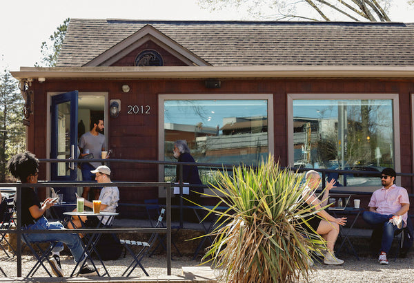 Drinking coffee on patio of Undercurrent Coffee CLT