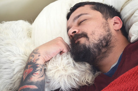 man with beard getting a good sleep