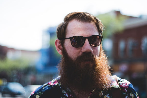 man with long beard wearing sunglasses
