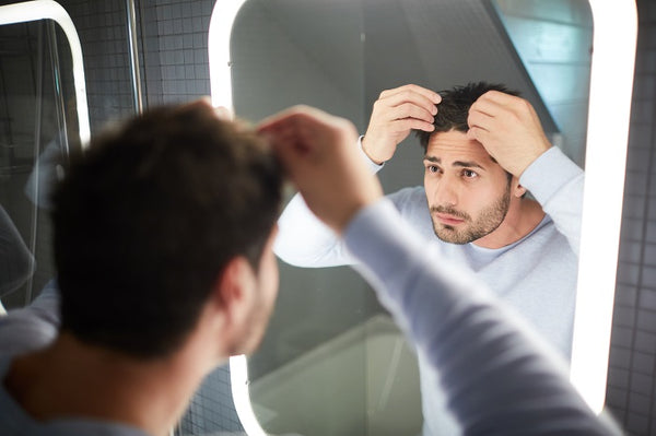 Man checking his healthy hair