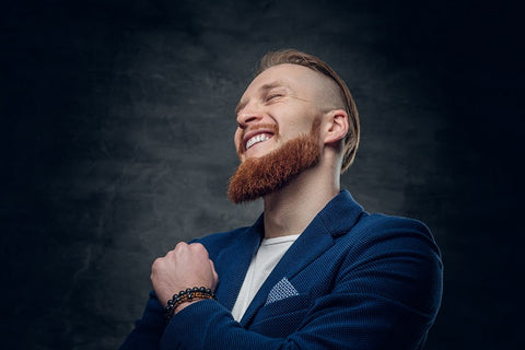 man with beard in a blue coat