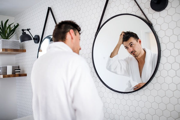 young man styling his hair