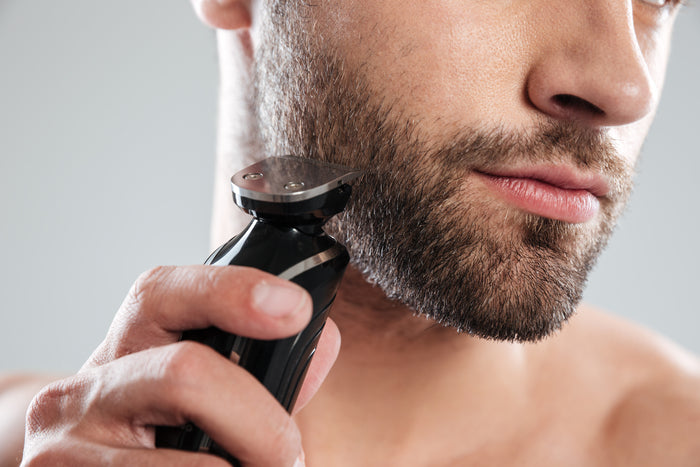 young man using shaving beard