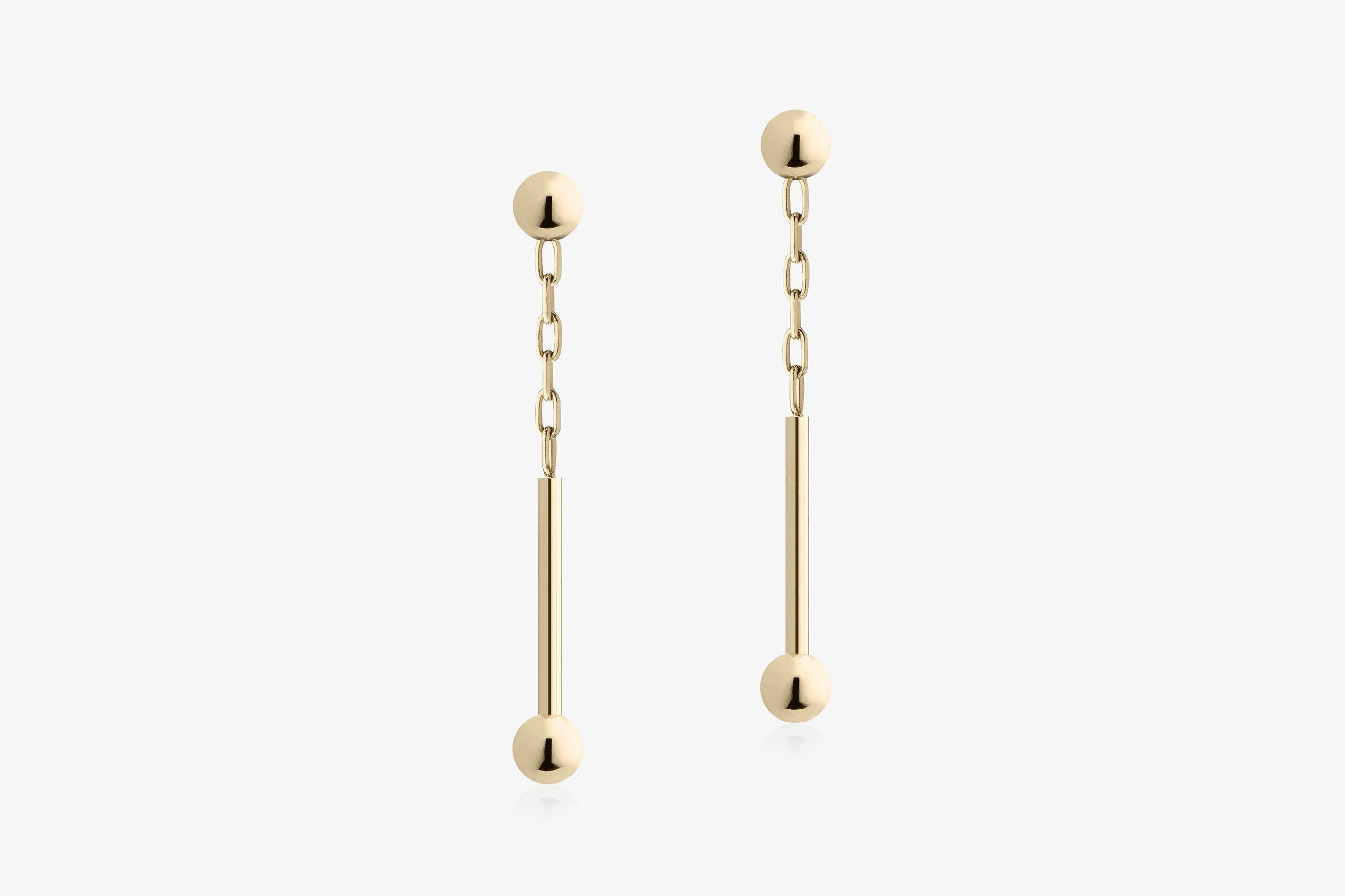 A view showcasing our Music Bar Drop Earrings - 22 Carat Gold Gilded