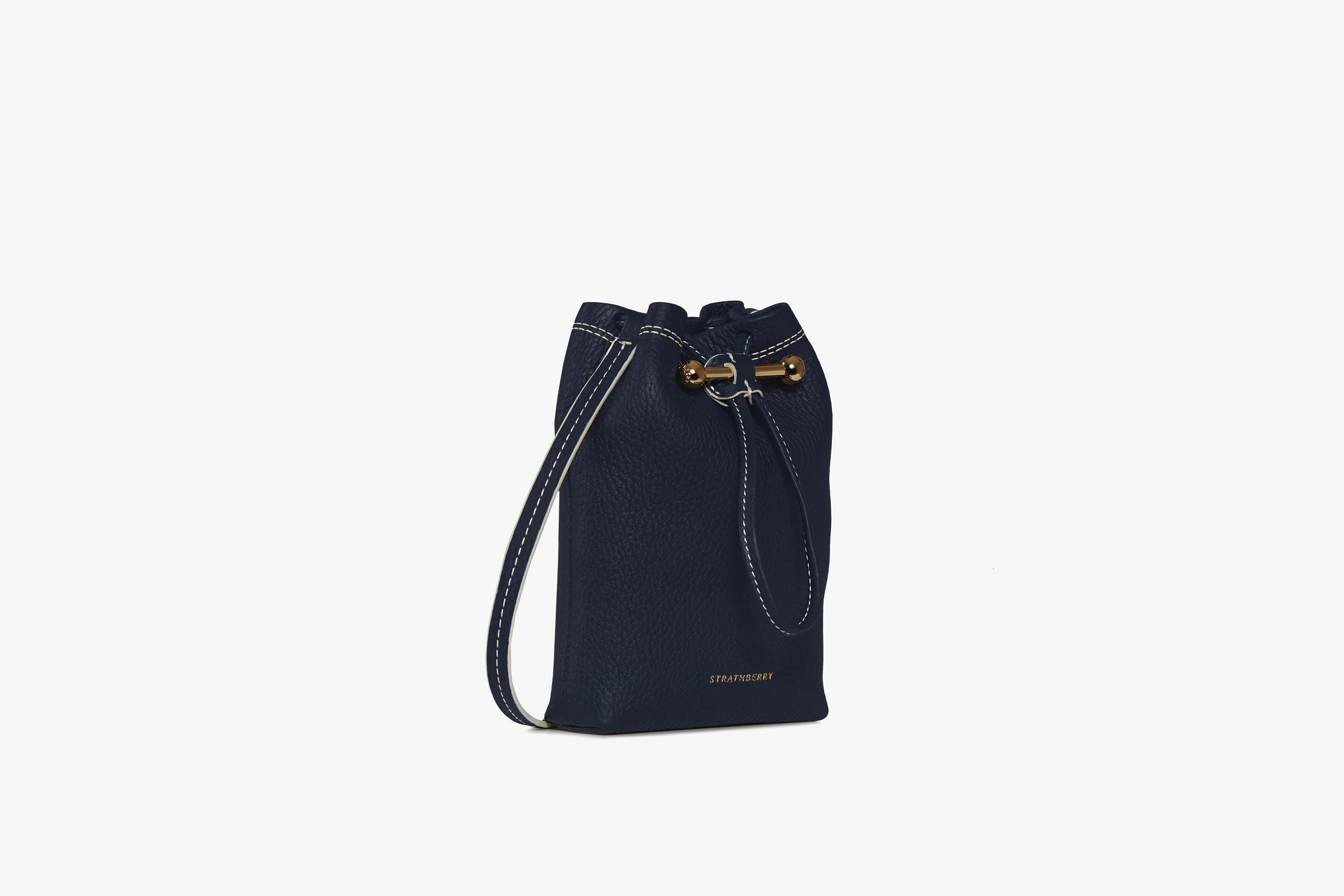 A view showcasing our Osette Pouch - Navy with Vanilla Edge/Stitch