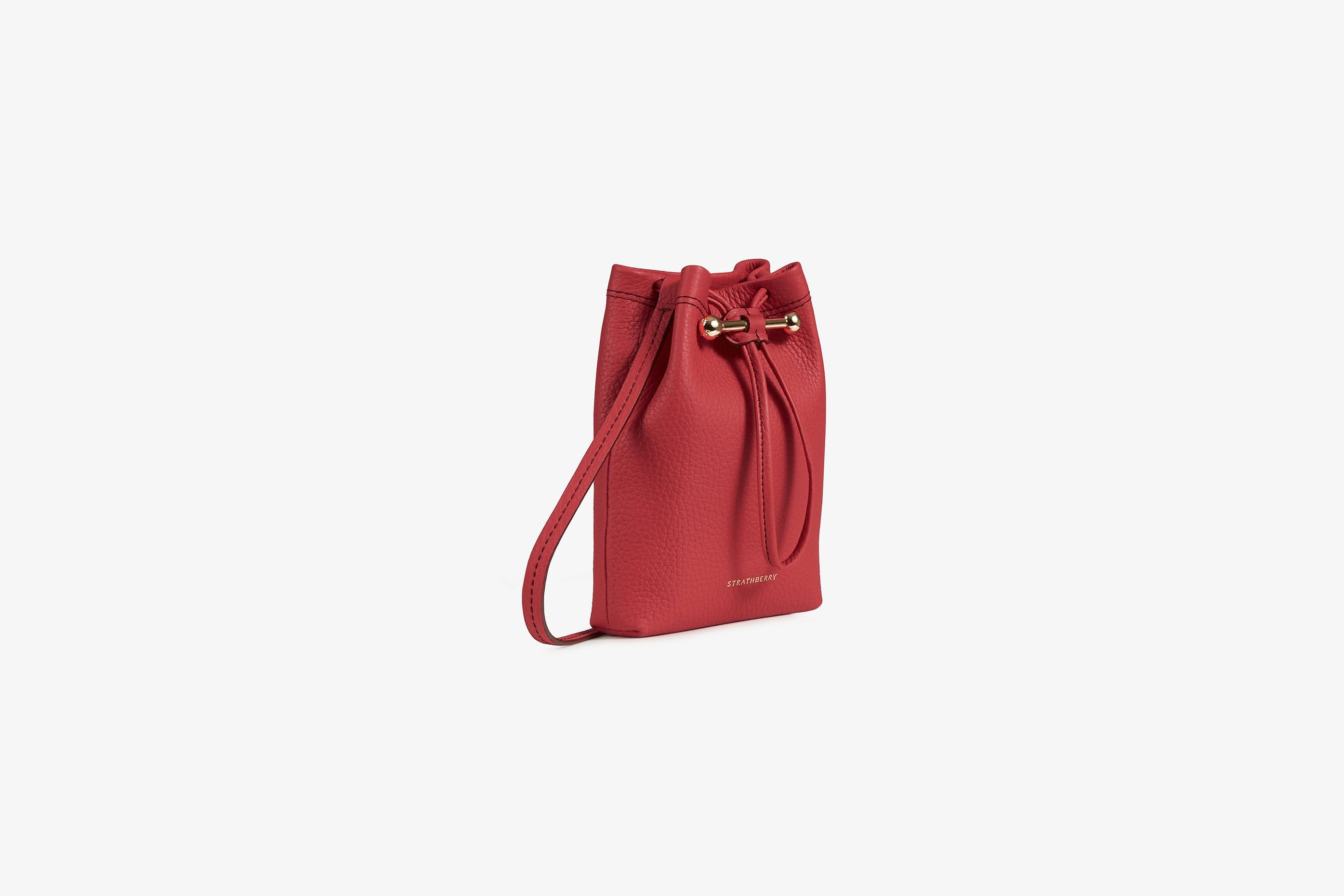 A view showcasing our Osette Pouch - Raspberry Red with Burgundy Stitch