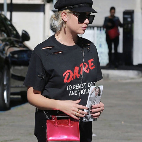 Ashley Benson carries The Strathberry Nano Tote in Metallic Ruby