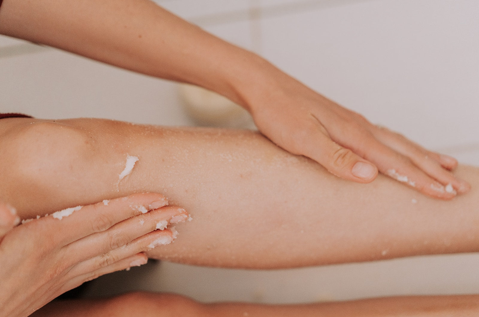 woman's soft legs exfoliated with chai tea sugar scrub