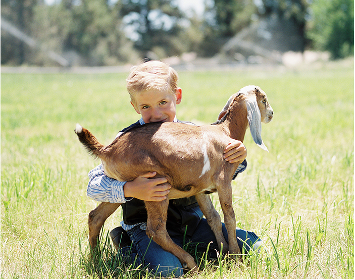 Young Boy Named Chance with Young Goat