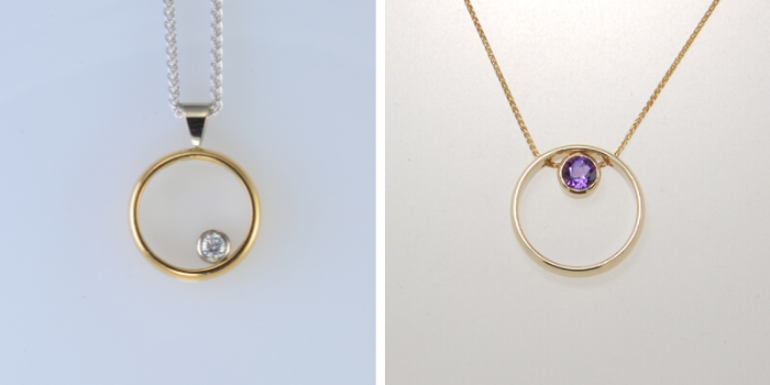 two wedding bands transformed to pendants adding a gemstone