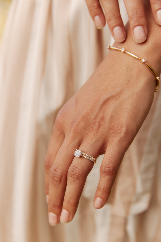 Model wearing diamond engagement ring